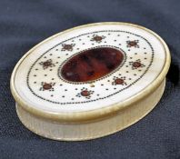 A mid to late 18th English oval ivory snuff box being inlaid with brass piqué and tortoiseshell