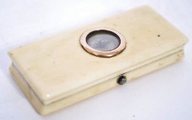 An 18th century gentleman's shaped ivory box with gold edged compass to the lid, the interior