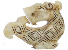 A Chinese green jade dragon pendant believed han dynasty, carved lozenge decoration to the body with
