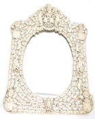 A 19th century large Ivory Dieppe wall mirror being intricately carved with repeating leaf works