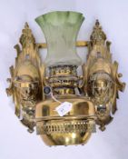 A Victorian French Art Nouveau brass twin branch wall mounted oil lamp with scrolling mask heads  on