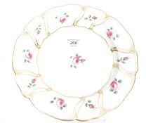 A 19th century Derby porcelain cabinet plate with scalloped borders having gilded edgings with