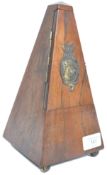 An early 20th century century rosewood cased metronome being of pyramidal form having a brass