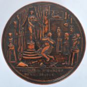 A good 18th century circular pressed wood snuff box, the lid with naked lady prancing around a