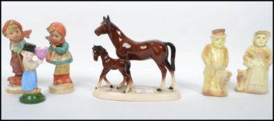 A collection of vintage ceramic figures dating fro