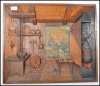 A mid 20th century black forest carved and painted