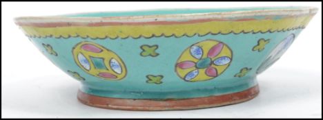 An early 20th Chinese blue ground bowl with painte