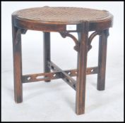 An early 20th century mahogany and bergere caned f