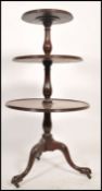 A 19th century Georgian mahogany three tier graduated buffet / dumb waiter, the two bottom tiers