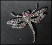 A 925 silver figural brooch in the form of  a dragon fly set with marcasite with green and red