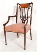 A good late 19th century mahogany and seaweed inlaid chippendale carver armchair. Raised on square