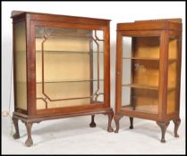 An Edwardian mahogany bookcase / display cabinet being raised on cabriole legs having twin astagal