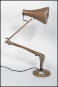 A Herbert Terrry Industrial anglepoise desk lamp raised on terraced base with pendant shade in an