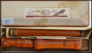 A vintage Adler three piece wooden recorder musical instrument complete in original box with applied