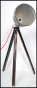 A vintage retro mid 20th century industrial lamp by Gnome raised on an adjustable tripod base