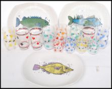 A good collection of mid 20th century drinking glasses some decorated with playing cards together