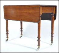 Victorian Mahogany Pembroke Table, mid 19th century, with two rounded drop leaves above one