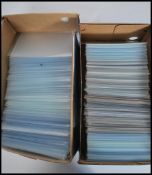 Postcard sleeves. Shoebox of plastic wallets (small size) and box of larger size. All clean,. no