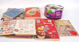 A good collection of stamps both loose and in albums dating from the late 19th century to include