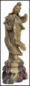 A 19th century Oriental Chinese carved soapstone figurine of a female deity raised on a carved
