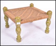 An early 20th century middle eastern Pakistani wooden foot stool of square form having a painted