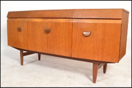 EoN - Elliots of Newbury - A retro 1970's bow fronted teak wood sideboard having shaped cup