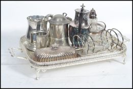 A collection of vintage 20th century silver plates items to include toast rack, sugar shaker,