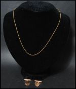 A pair of hallmarked 9ct gold vintage cuff links ( one af ) along with a 9ct gold fine link necklace