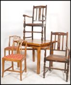 A 1930's oak draw leaf dining table of square form together with 2 oak carver chairs and a set of