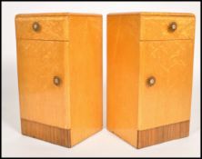 A pair of 1930's Art Deco birds eye maple bedside cabinet lockers. Each raised on a plinth base with