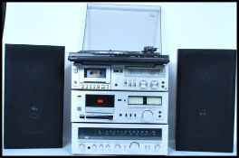 A retro harlequin 20th century stacking system in chrome finish consisting of a Sansui R - 30L