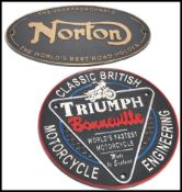 A pair of vintage style cast metal point of sale advertising garage wall plaques for Norton and