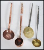 An 18th / 19th century brass water / toddy ladle, possibly naval in origin, turned handle riveted to