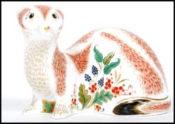 A Royal Crown Derby Stoat paperweight, with red stamp to underside, dated 2013 and gold stopper, 8cm