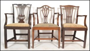 A set of three harlequin 19th century Georgian mahogany carver dining chairs Hepplewhite manner