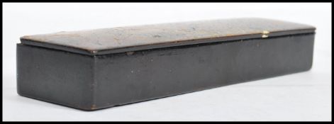 A 19th century papier mache pen box, the lid decorated with scene of girl and boy playing in the