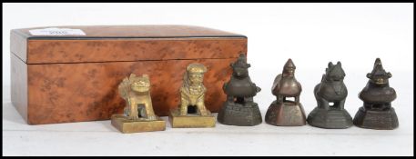 A 19th century birds eye maple wooden box containing a collection of Oriental Chinese bronze and