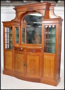 An Edwardian mahogany inlaid Arts & Crafts breakfront sentry box mirror back sideboard. Raised on