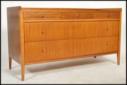 A 1950's vintage sideboard with 3 drawers along top and long long full length drawrs with rim top