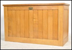 An unusual mid century large oak eclesiastical vestment - front chest coffer. Of light oak form with