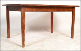 William Lawrence - A 1970's retro large teak rectangular extending leaf table having a flip out leaf