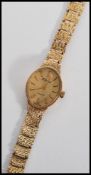 A 20th century  ladies 9ct gold cased bracelet watch by H Samuel, having quartz movement set to a