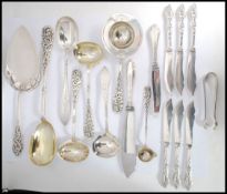 A collection of Danish Silver Plated serving spoons and ladels each with  with intricate rococo