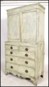 A 19th century shabby chic country cabinet on chest of drawers / dresser. Raised on bracket feet