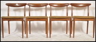 A set of 4 1970's teak and faux leather Danish influence ' propeller ' back dining chairs being