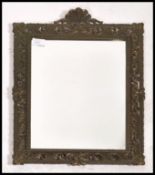A 20th century Italian cast metal Florentine revival wall mirror having a pierced frame with