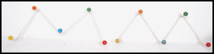 A matching pair of retro mid 20th century sputnik atomic space age coat hooks of wave form having