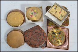 A collection of vintage 20th century compacts to include Mascot, engine turned, 1950s black jazz