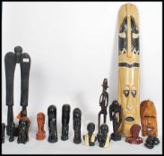 A large collection of tribal African related items to include busts, wall masks, hair fly swat whisk