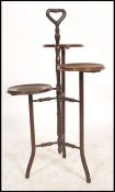 An early 20th century mahogany tiered wine stand. The central column with  three staggered